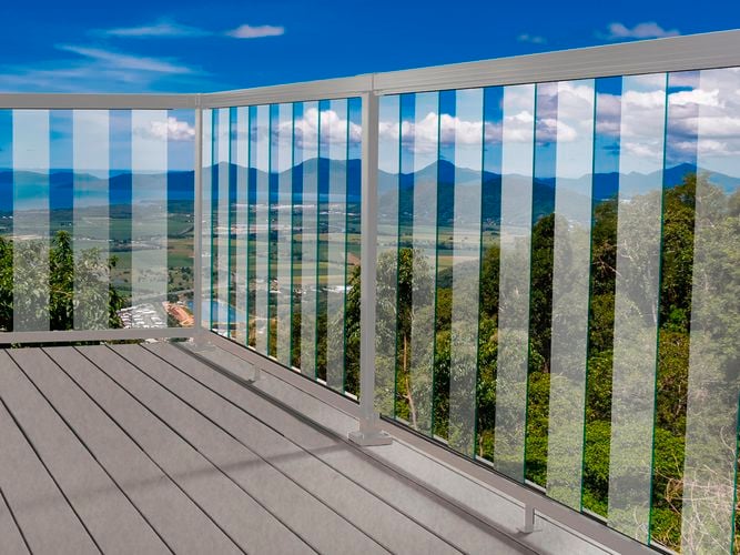 Silver balustrade system with glass panels.