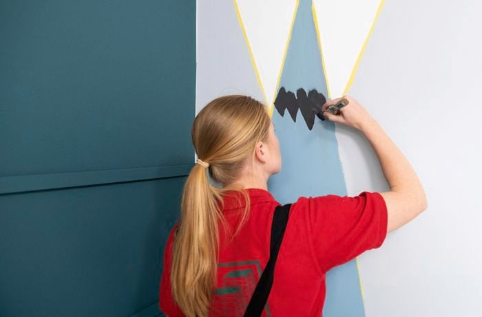 Person painting wall.