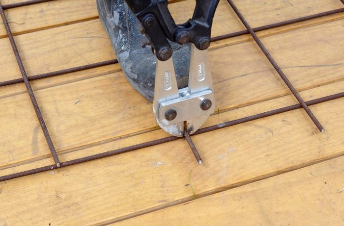 Heavy duty wire cutters used to trim excess wire from the ends of a frame
