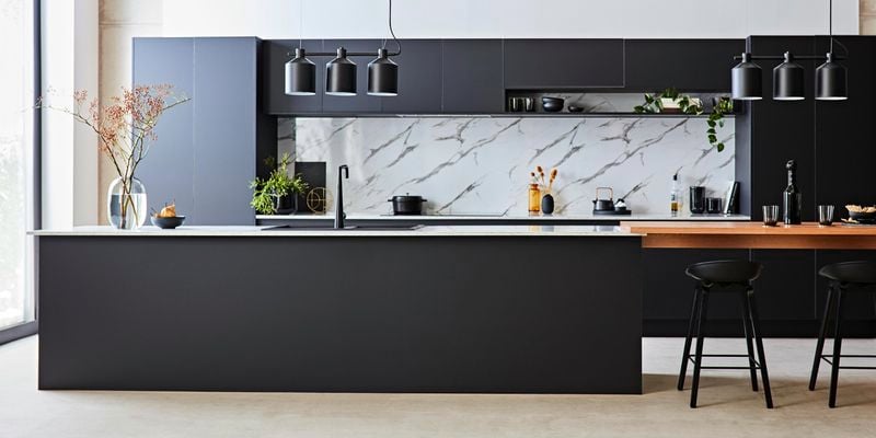Modern Kitchen with matte finish cupboards, marble splashback and a floating dining bench area.