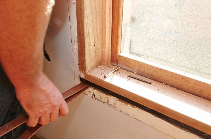 Using masonite packers to level the window