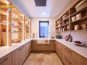 Butler’s pantry from The Block with timber cabinetry, open shelving, farmhouse sink, and stone benchtops.