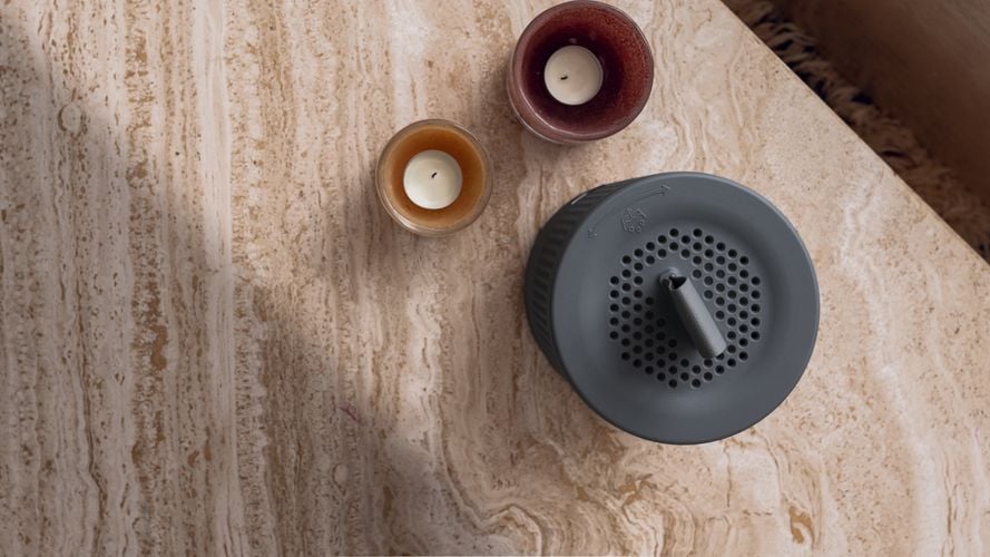 Top view of a stylish moiture absorber with home décor on a table