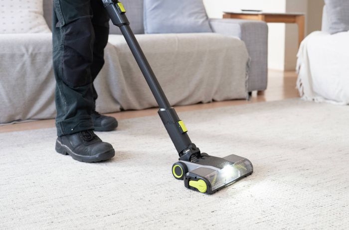 Vacuum carpet in a high-traffic area of the home​​