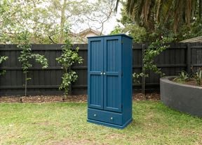 Freshly painted wardrobe in middle of lawn
