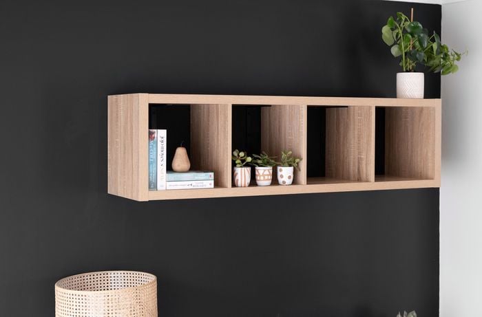 A personalised study nook, complete with shelving and pot plant