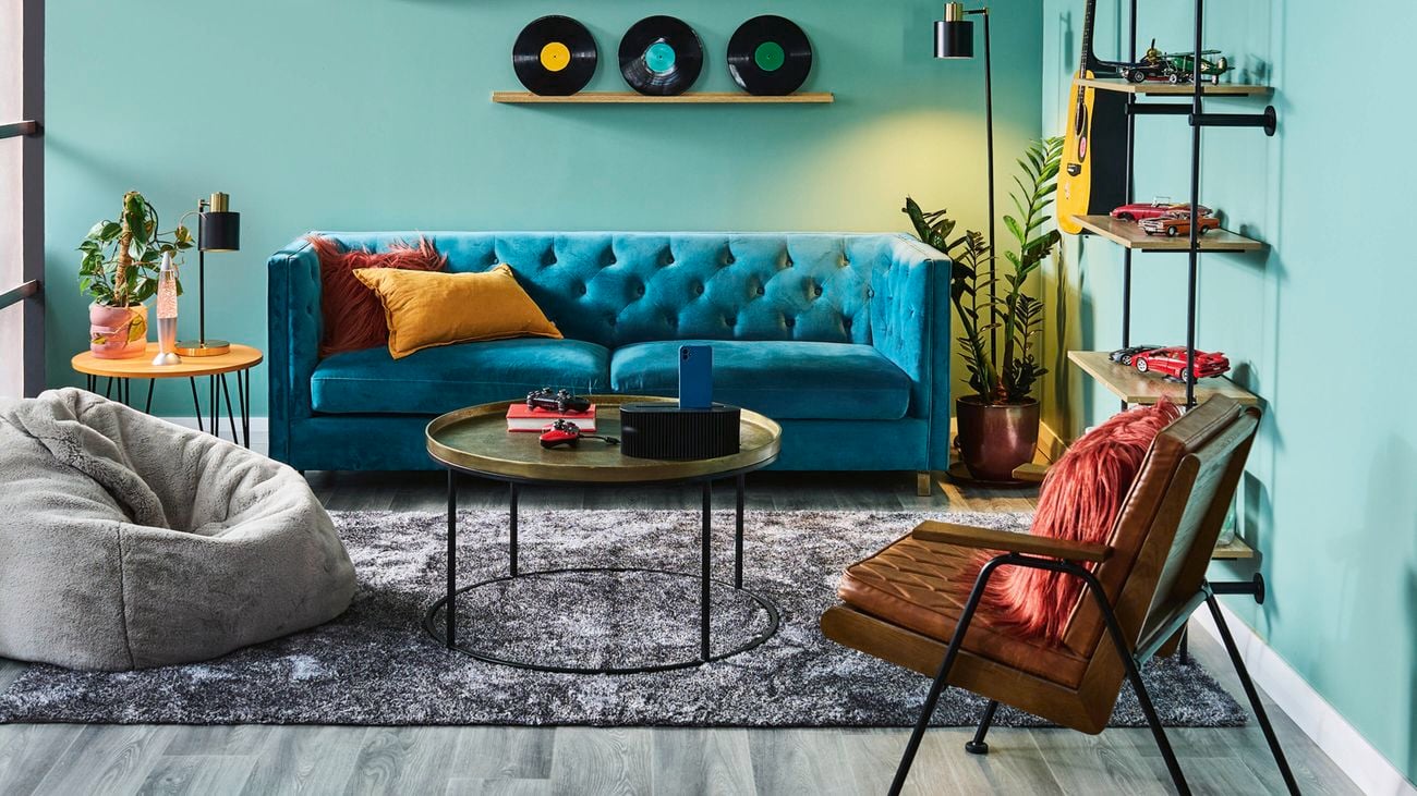 A room painted with Dulux Mokai Canyon displaying records and car models on shelves