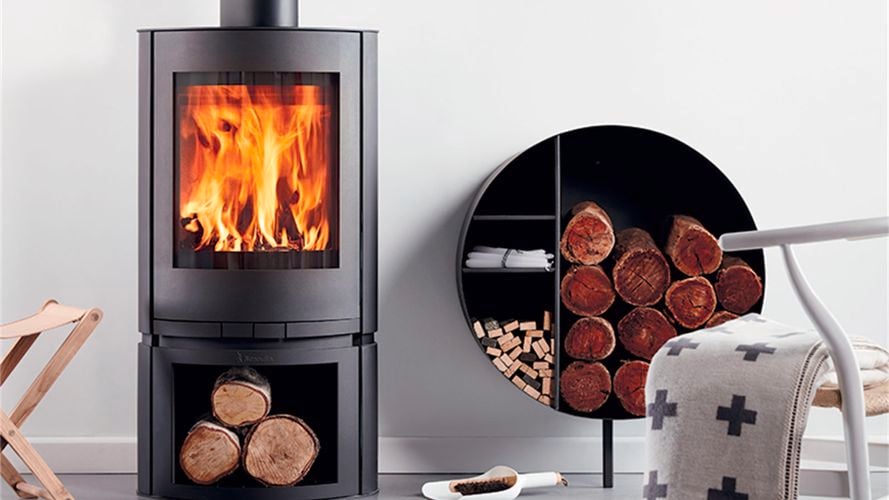 Scandia fireplace in room with timber in timber holder
