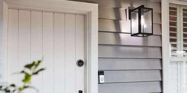 Front door with Ring doorbell and security light.