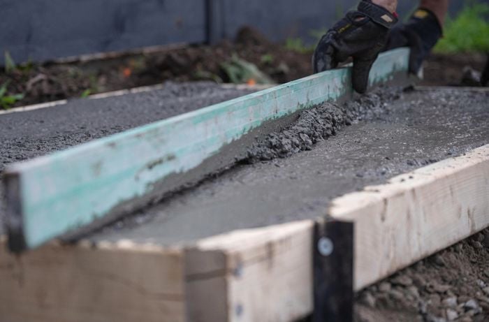  Screed the concrete.