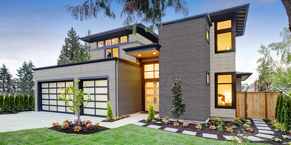 A new two-storey house with grey stone-like cladding