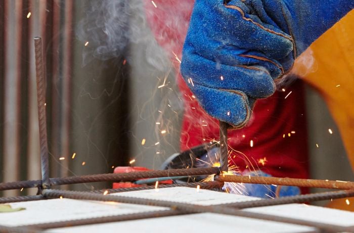 Closeup of welding together a wire mesh frame