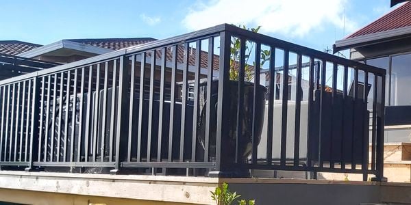 Balustrade fencing around a deck in the backyard of a house