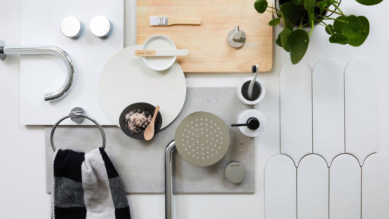 A flatlay of neutral bathroom fittings and accessories