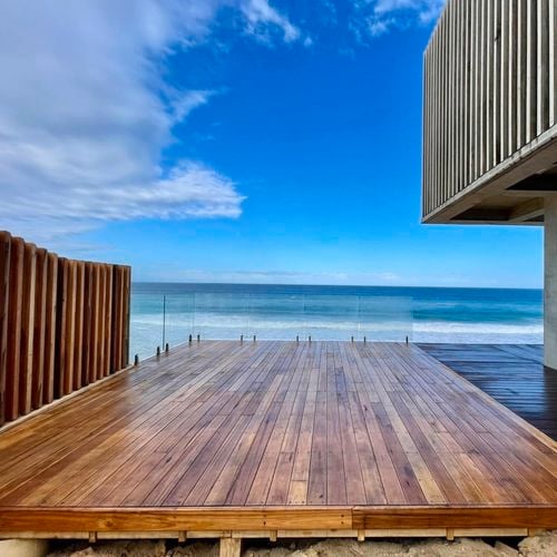 Deck with glass panels looking out to the beach