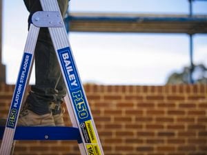 Tradie working on Bailey ladder