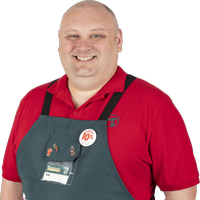 Bunnings team member Tim wearing a Bunnings apron.