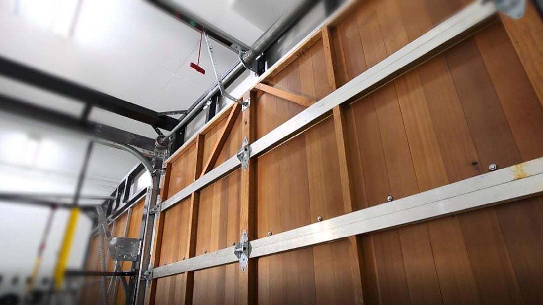 Closeup of the inner workings of a manual-open garage door