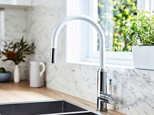 White sink mixer with splashback.