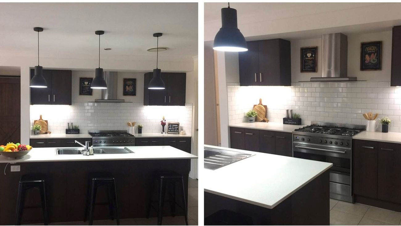 Two images of the same modern white kitchen with brown cupboards, pendant lights hanging from the ceiling and a white benchtop.