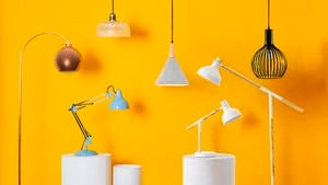 A series of pendant lights and lamps lined up.