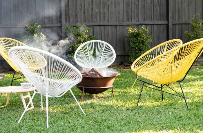 Chairs set around a firepit.