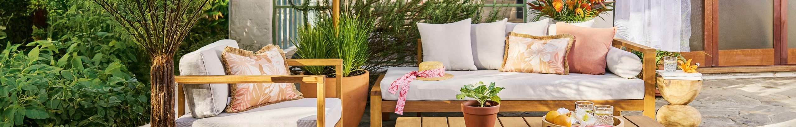 Outdoor dining setting in a styled outdoor space.
