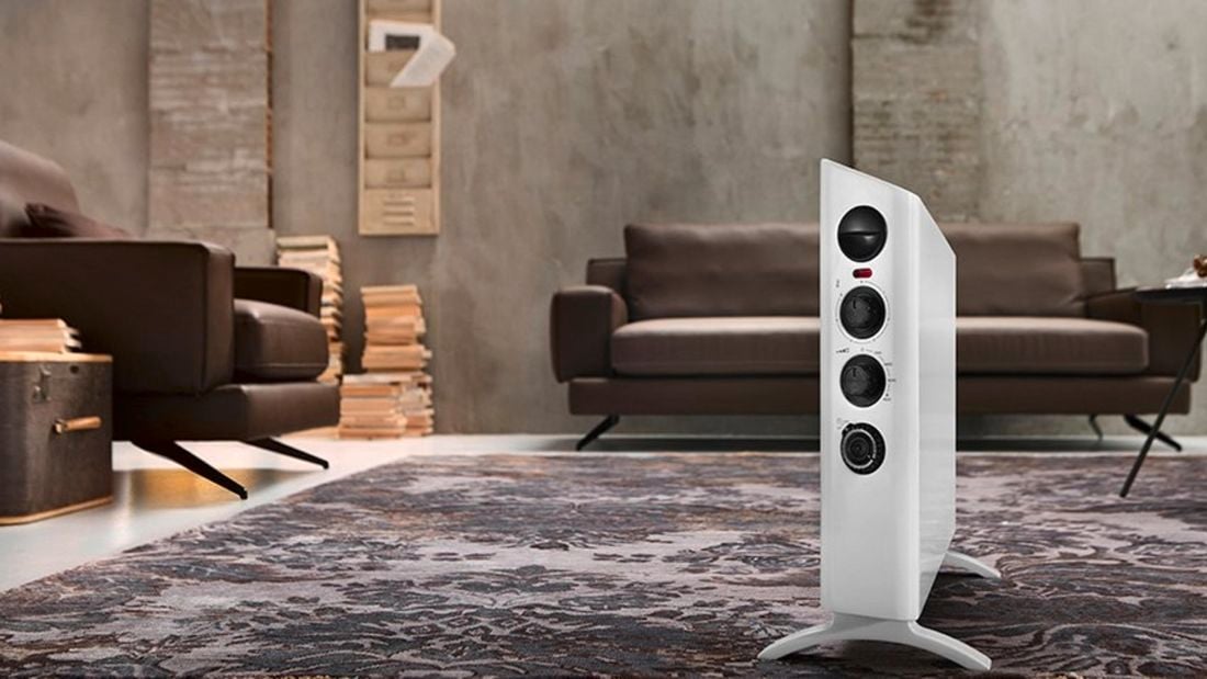 Heater in a lounge space with couches and cosy interior.