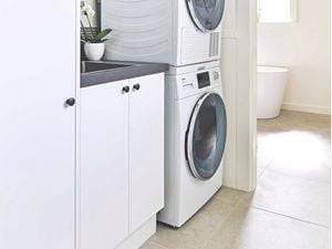 Image of a washing machine in a laundry.
