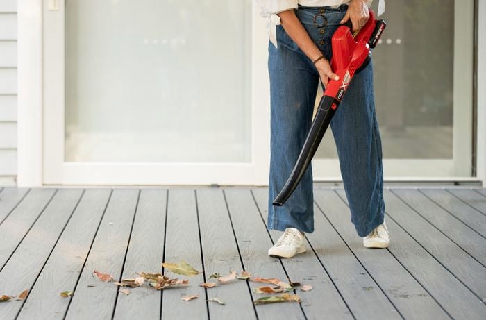 Person using a leaf blower.