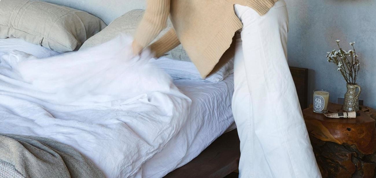 Person making bed