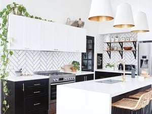 Monochrome kitchen style with a white subway tile splashback 