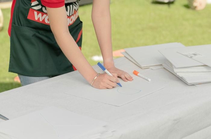 Writing letters on corflute.