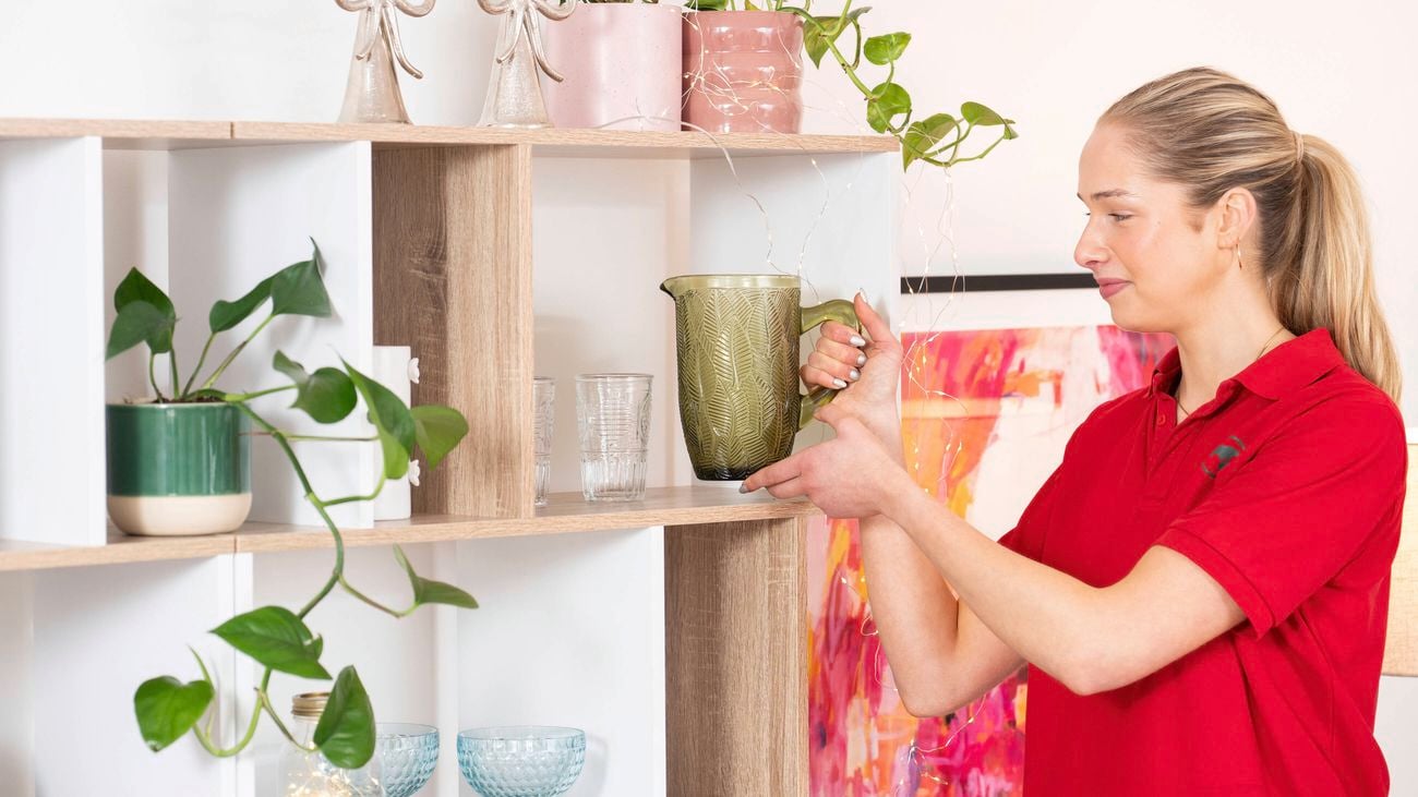 Arrange decorative pieces in open shelf styling