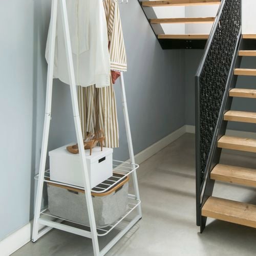 Under the stairs clothes storage set up