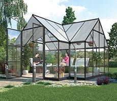 Two people sitting on lounges in a glass shed
