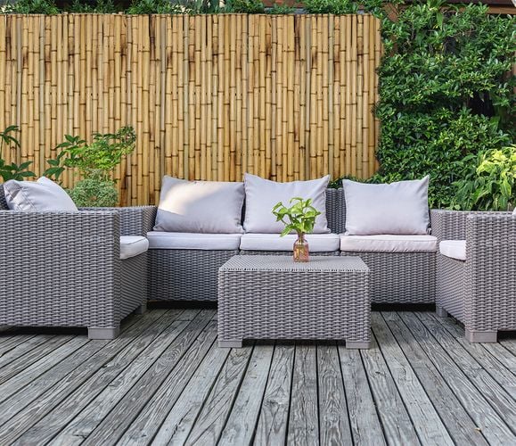 Bamboo fence surrounding timber deck