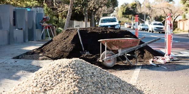 Large piles of soil in suburbia street