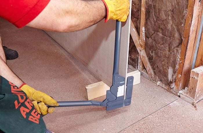 Short panels of villaboard being cut with a fibrocement cutter