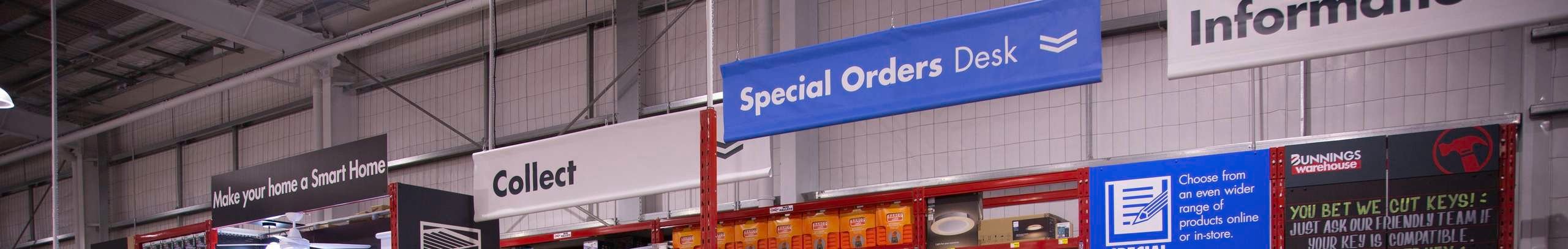 Customers and team members surrounding Special Orders Desk near the Special Orders Desk Brochure Stand