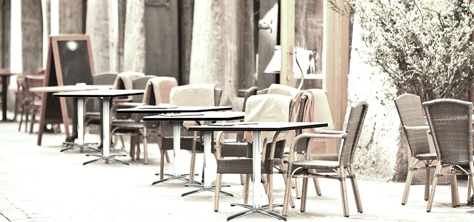 Footpath with outdoor cafe tables and chairs