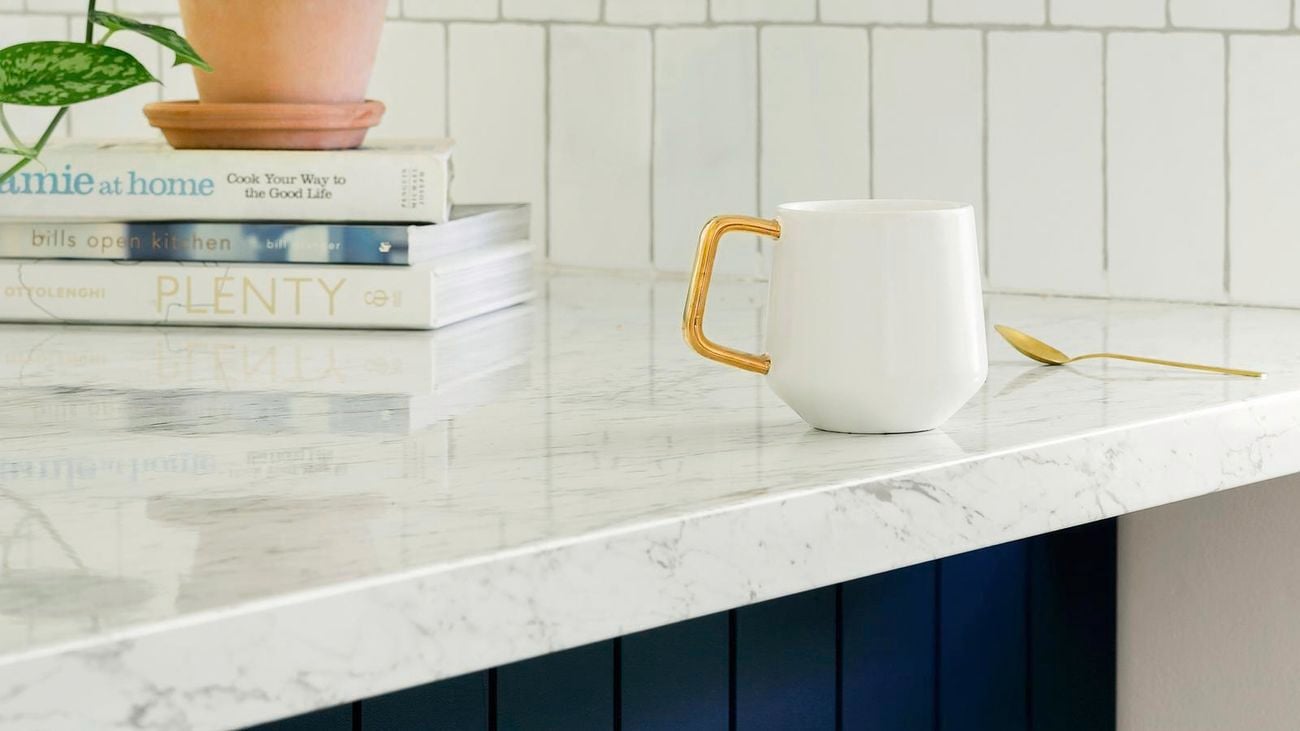 cup and spoon on benchtop top close up 