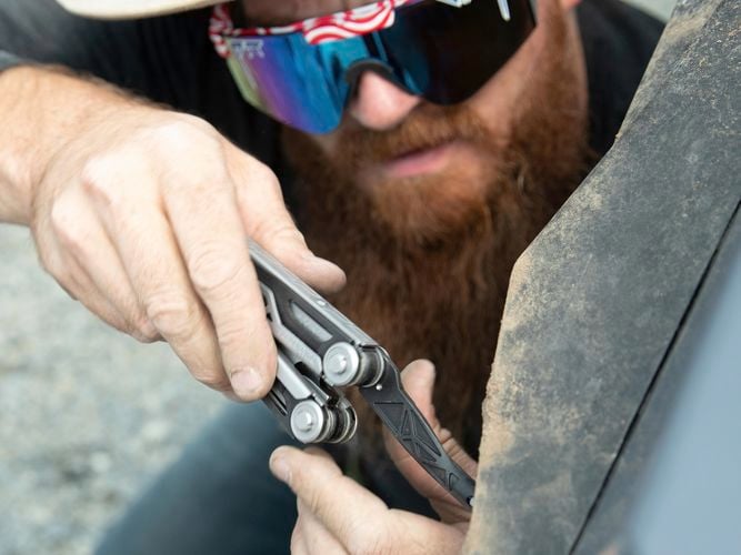 A person using a dual force multi tool.