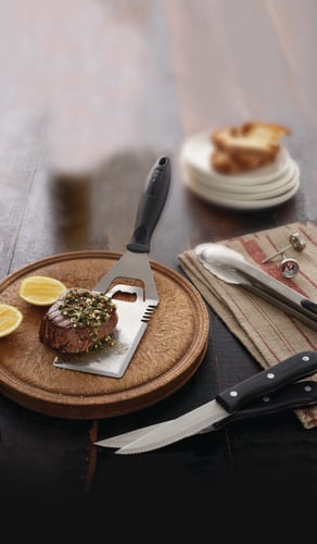 Steak resting on a barbecue flipper