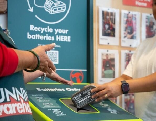 customer recycling old battery at bunnings store