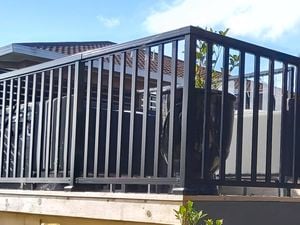 Balustrade fencing around a deck in the backyard of a house