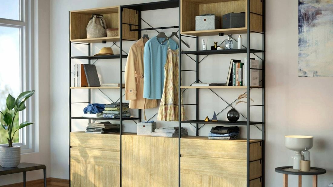  An image of an open wardrobe made from Flexi Storage Studio Silhouette shelving units in Black and Oak, with open shelves, 2 drawer units and a cabinet in Oak
