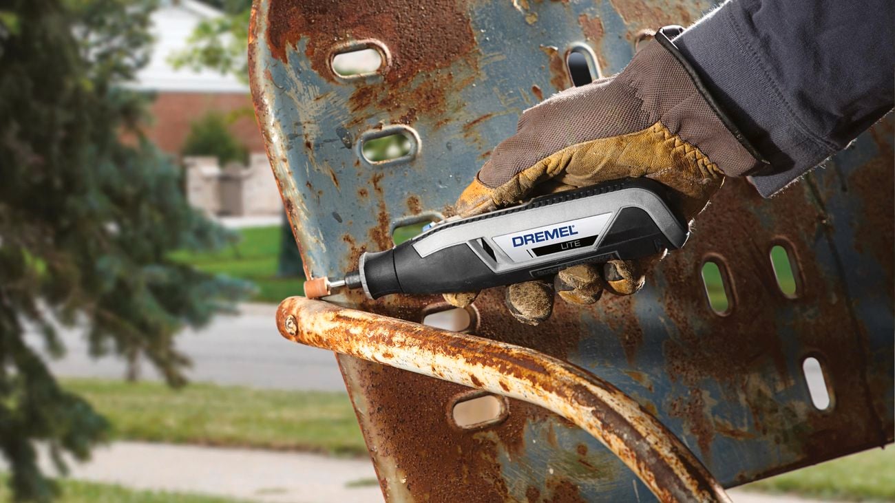 Dremel tool is used to remove rust from an old chair