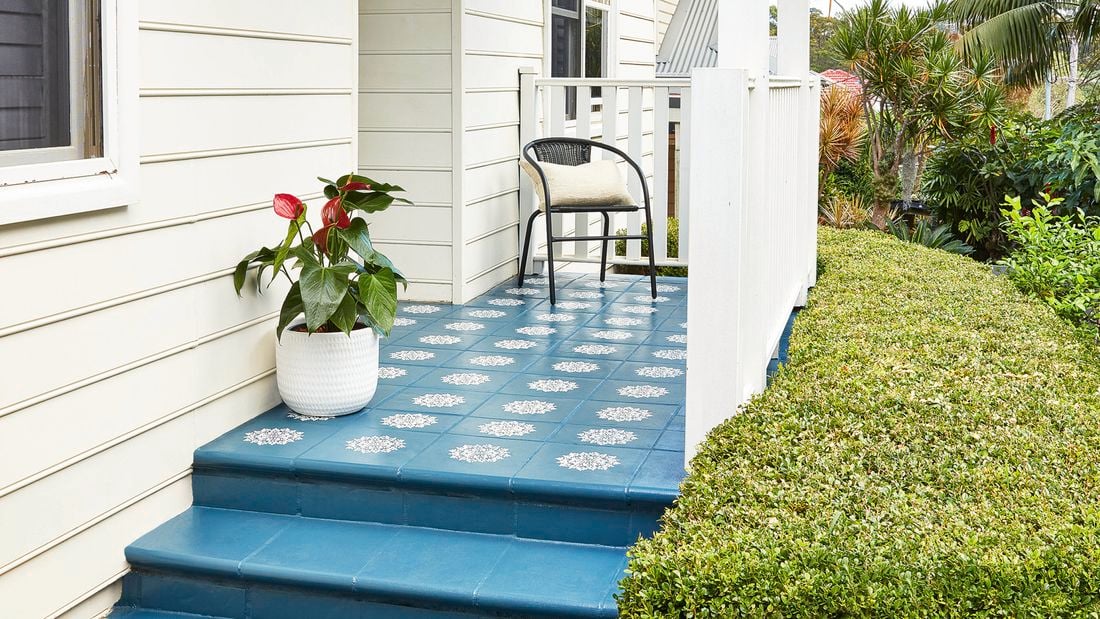 Blue tiles Stencilled pathway leading up to the front door, with white timber railing
