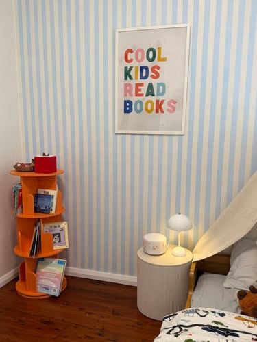Kids bedroom with a striped blue and white feature wall